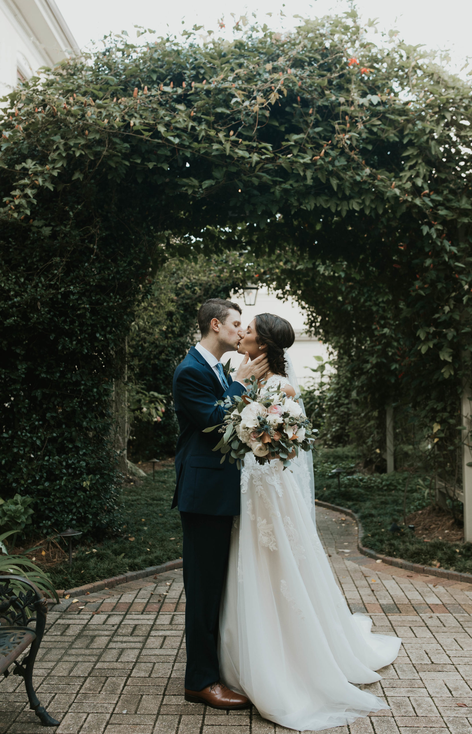 bride and groom kissing at southern hotel