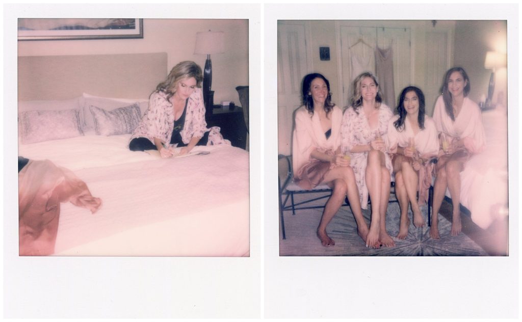 Two Polaroid wedding photos show the bride writing her vows on her bed and posing with her bridesmaids in robes during prep.