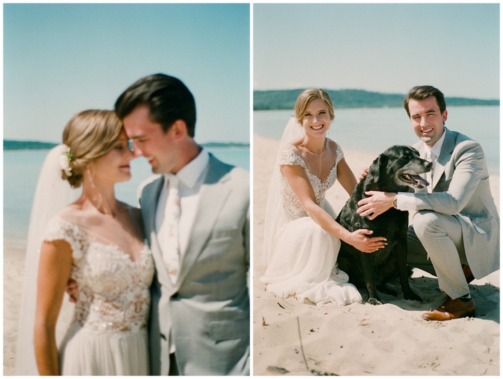 A couple poses on a beach with their dog in wedding photography on film. 