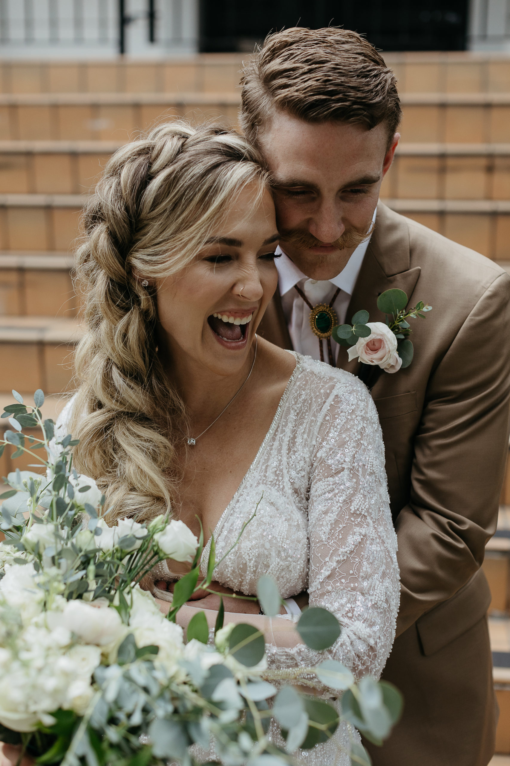 A couple smiles before their Rosy's Jazz Hall wedding