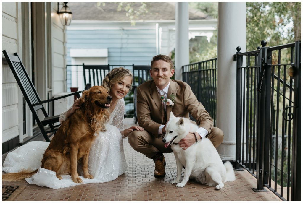 The couple poses with their dogs for the Rosy's Jazz Hall wedding
