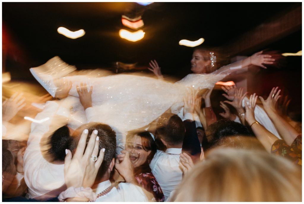 The bride crowd surfs at Rosy's Jazz Hall 