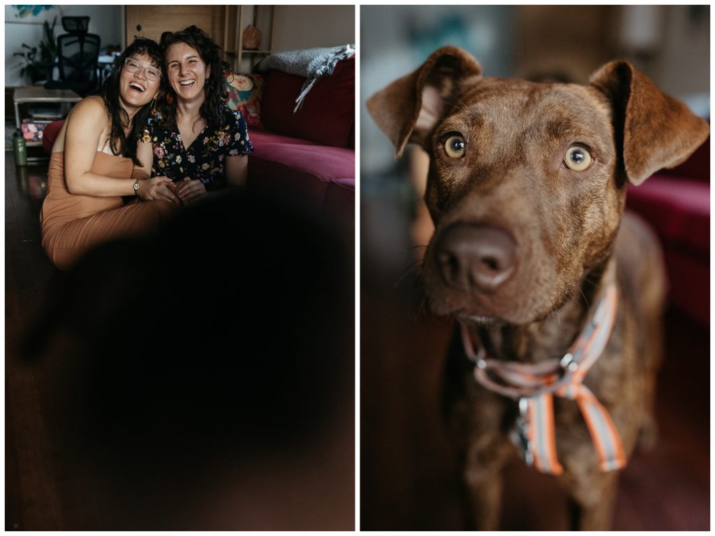 The couple sits on the couch with their dog for their engagement photos at home