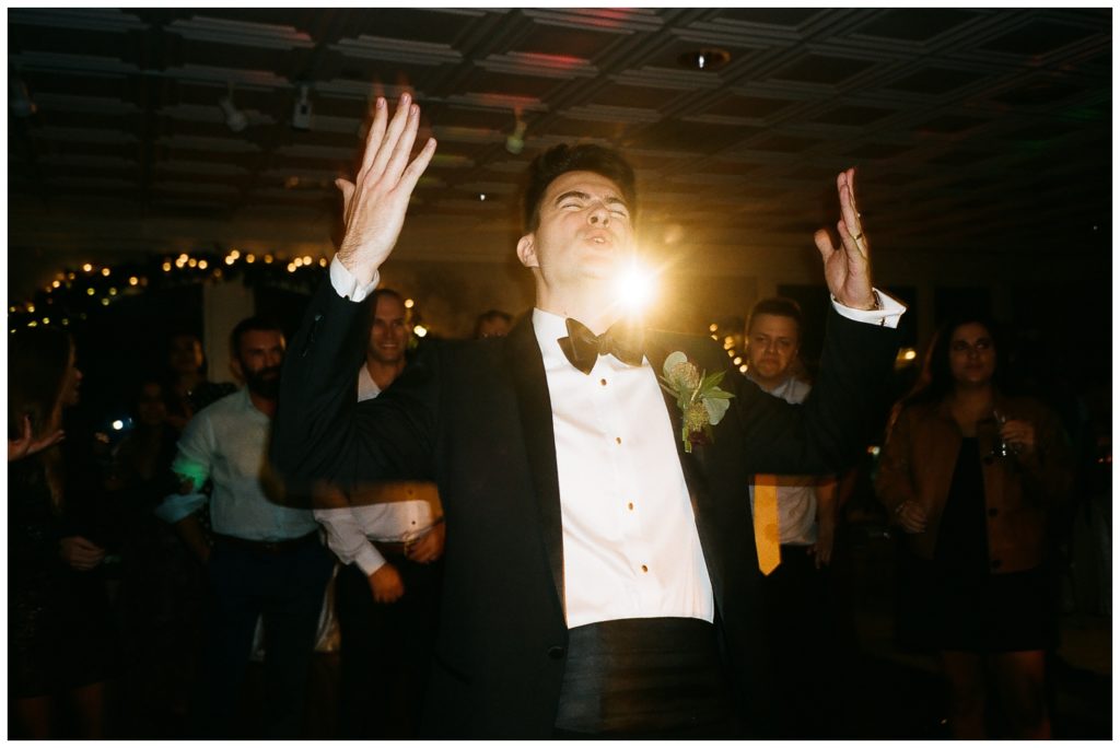 The groom dances at the Riverview Room