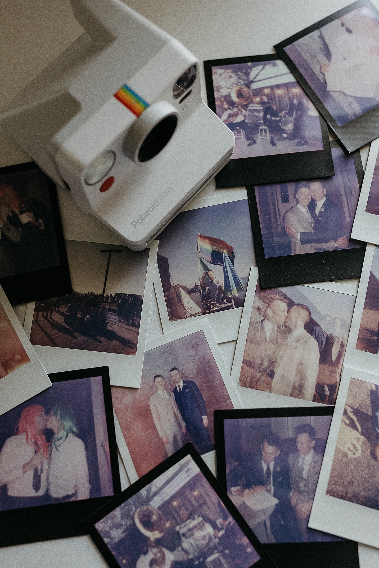 The best instant film camera sits on a stack of Polaroids
