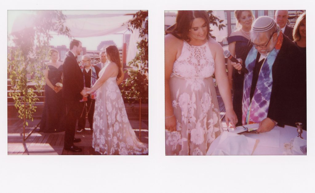 A photographer uses the best instant film camera at a Jewish wedding ceremony