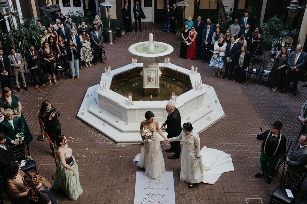 The brides meet at the altar in the Hotel Mazarin courtyard.