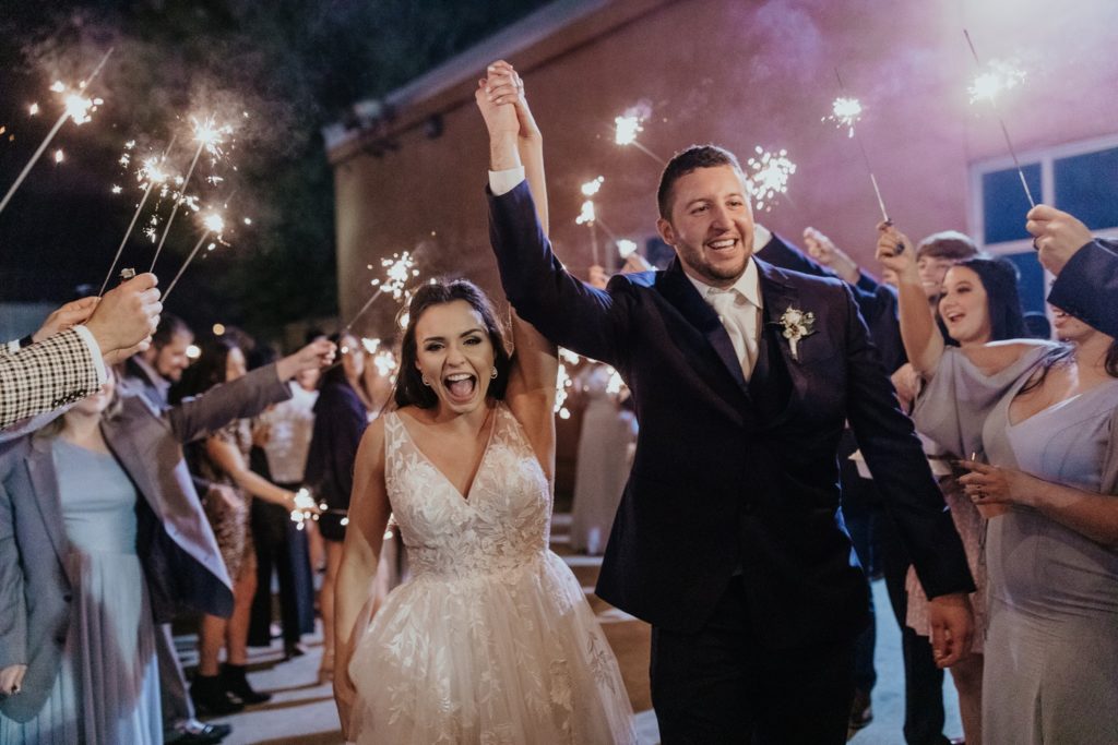 Bride and groom sparkler exit photo