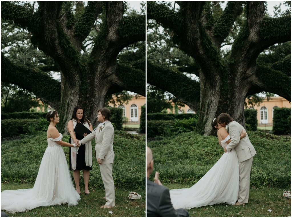 Britt kisses Em at their New Orleans Botanical Garden wedding.