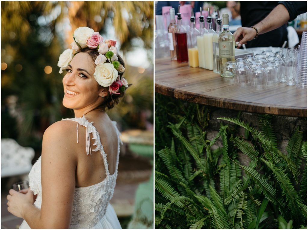 A bride wears a flower crown and drinks a cocktail at Derbes Mansion.