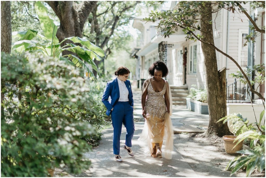 A wedding couple walks down Esplanade Avenue in New Orleans.