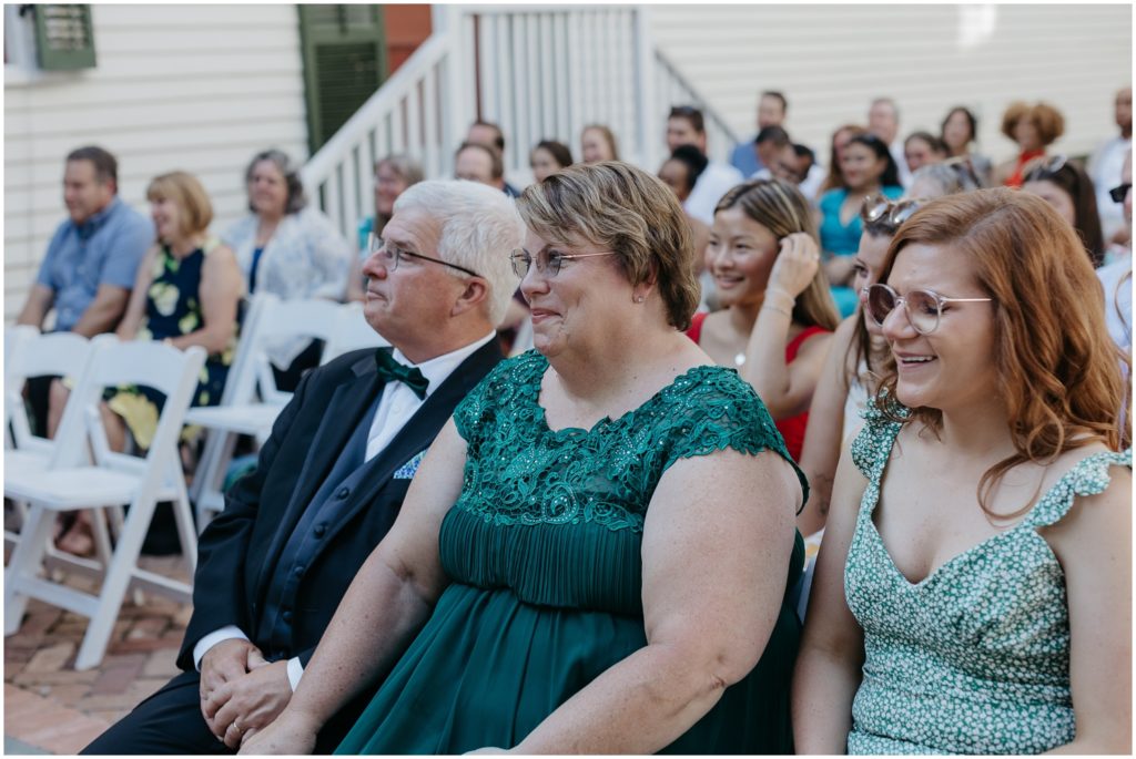 Alex's family smiles at the wedding ceremony.