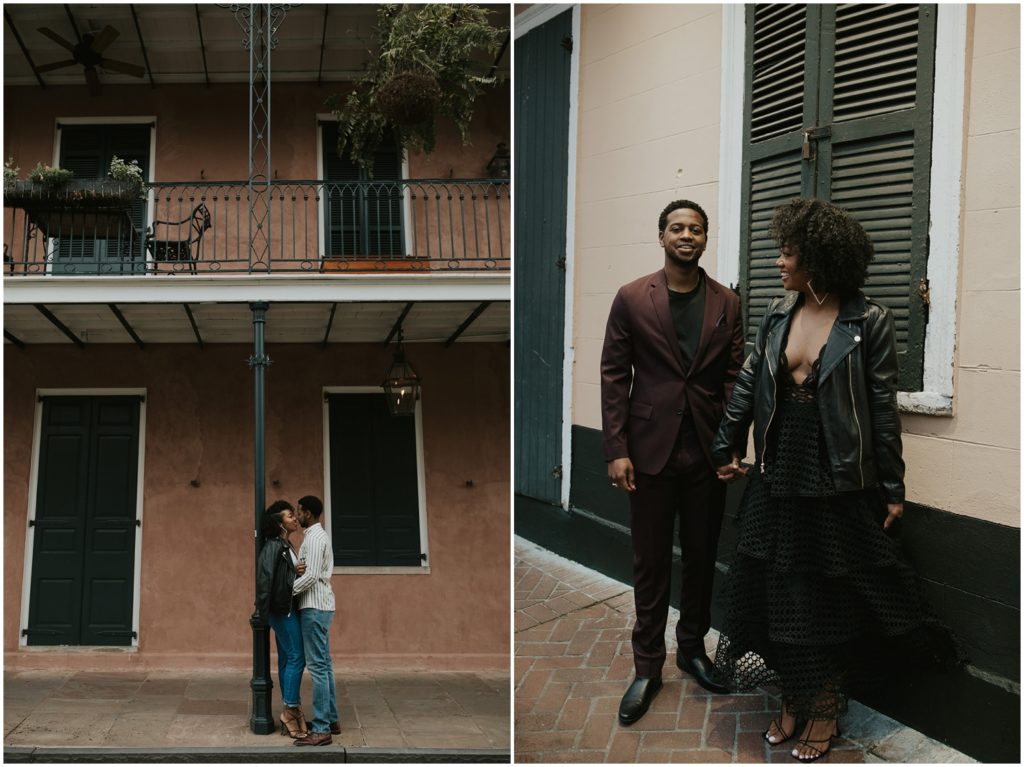 A man and woman walk through the French Quarter for an evening engagement session.