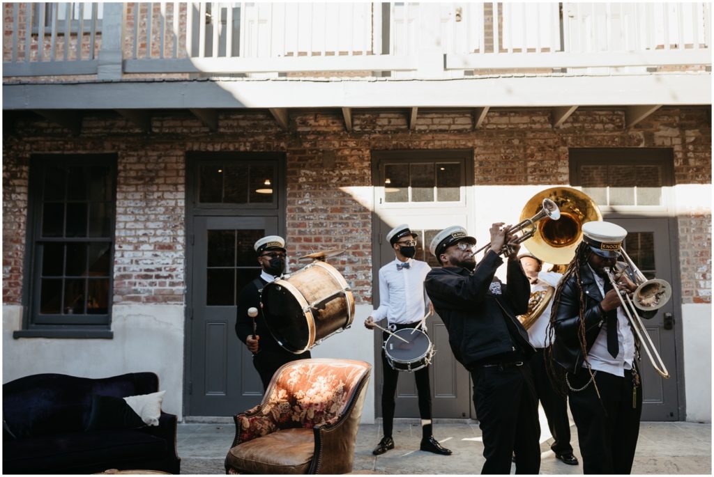 A New Orleans second line band plays during a first dance.