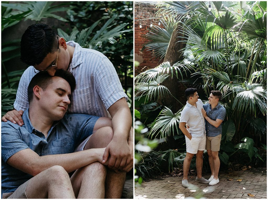 Enrique kisses Caleb's head beside a palmetto during their French Quarter engagement photos.
