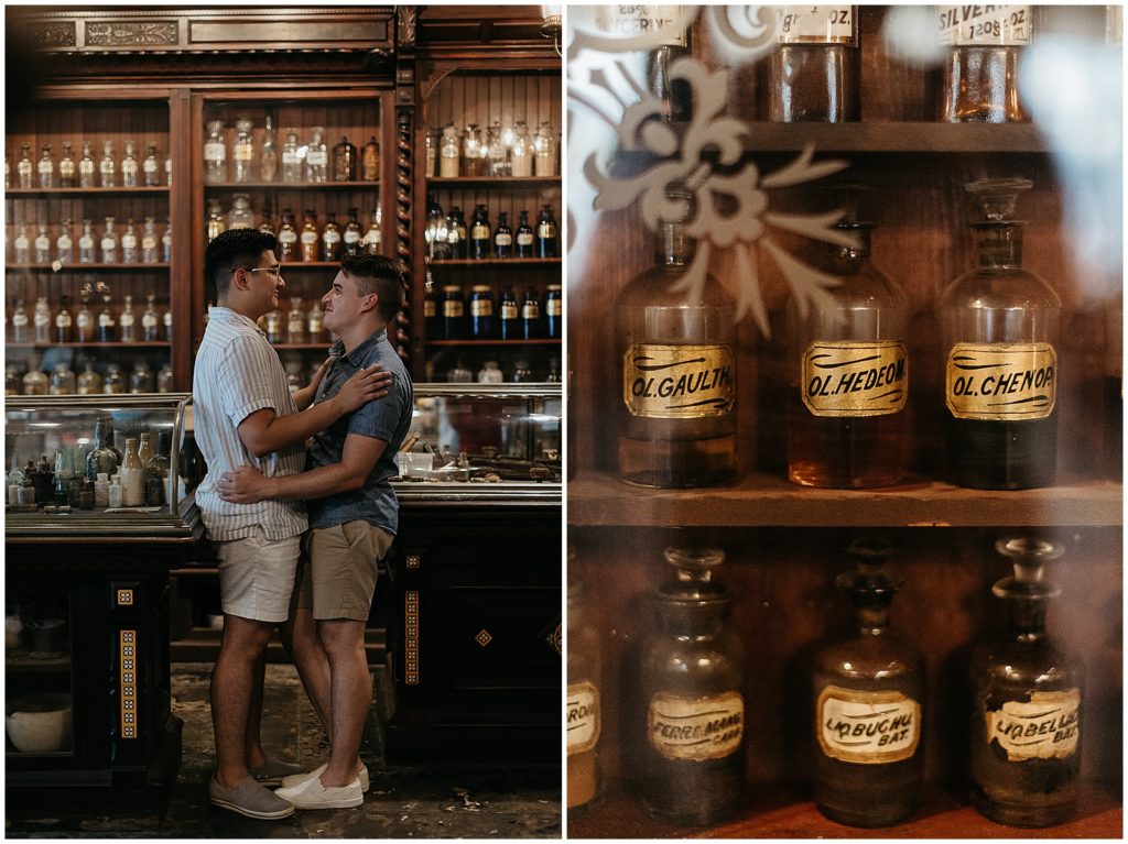 Two men embrace for French Quarter engagement photos at the Pharmacy Museum.