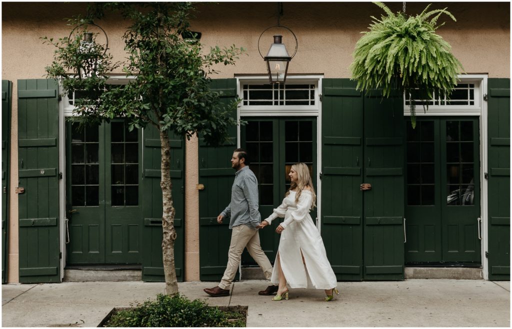 Patty and John walk through the French Quarter during their engagement session.