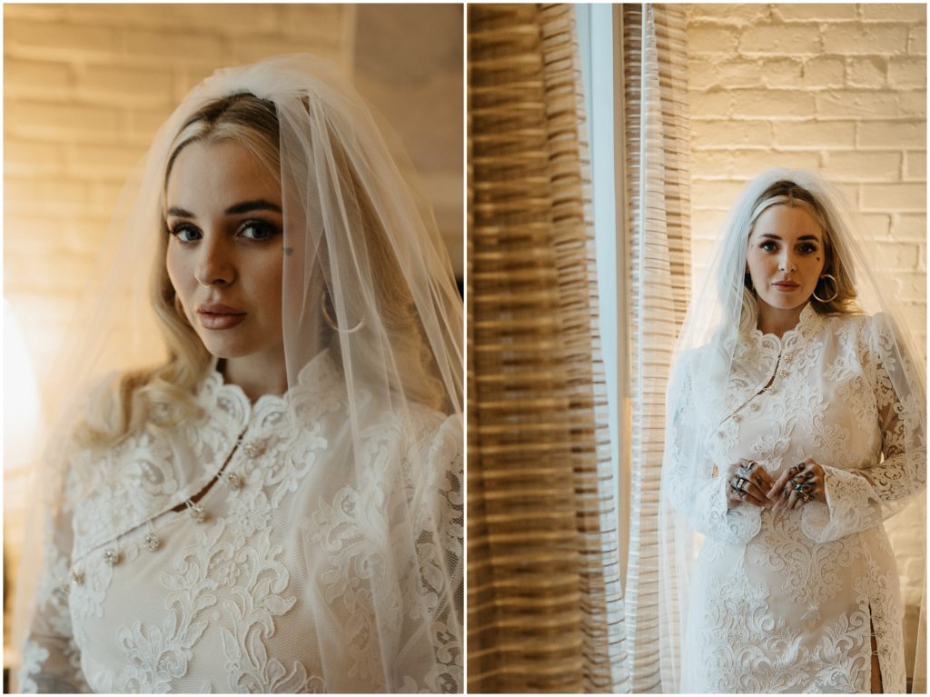A woman poses in a lace wedding dress in a New Orleans hotel.