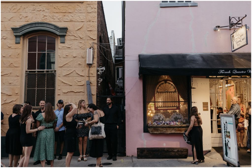 Wedding guests gather outside the French Quarter wedding chapel.
