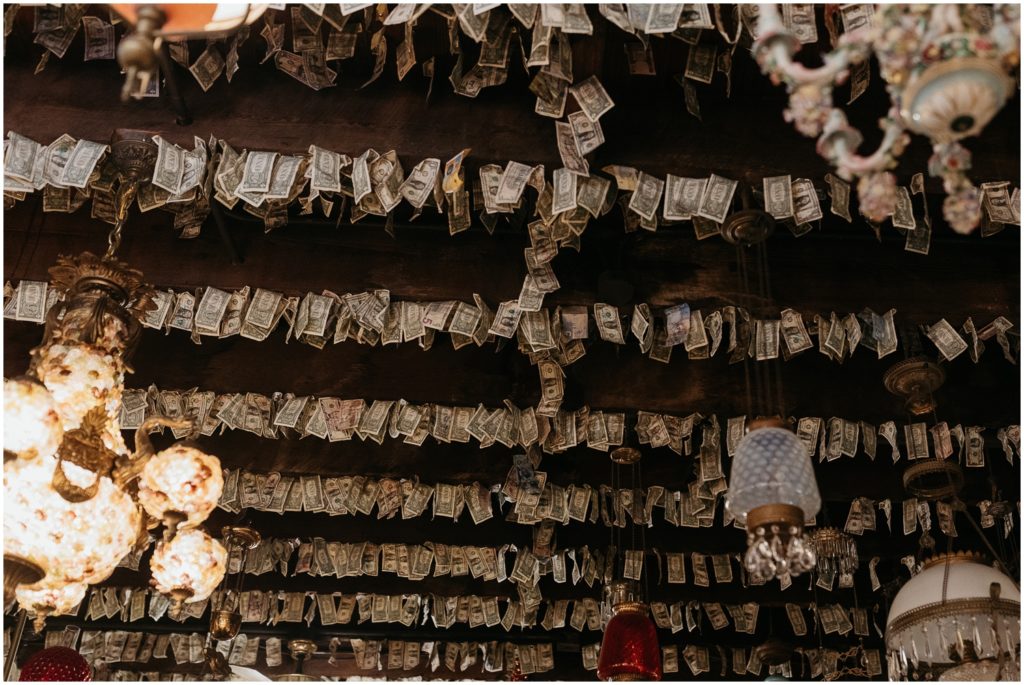 Dollar bills hang from the ceiling of the New Orleans wedding chapel in rows.