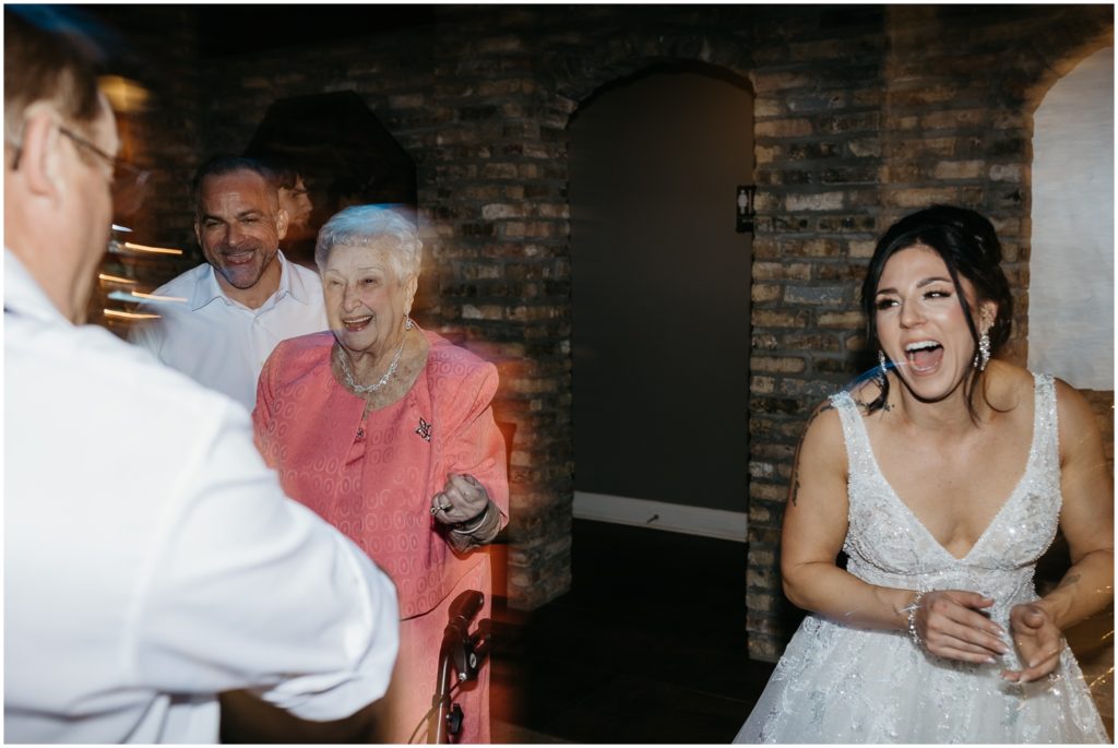 Beth laughs as she dances beside older family members.