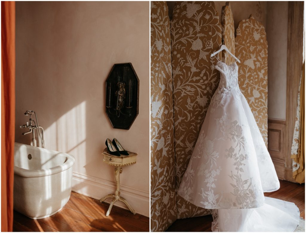 A wedding gown hangs in front of gold curtains at Hotel Peter and Paul in New Orleans.