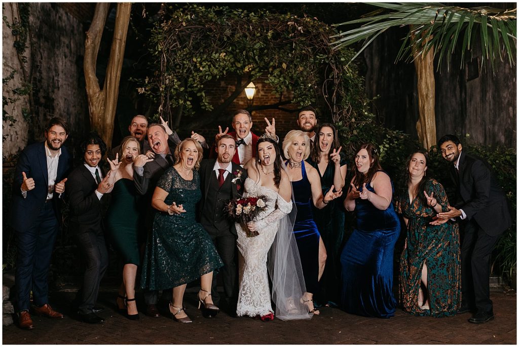 Hallie and Conor pose with their wedding guests for a group photo.