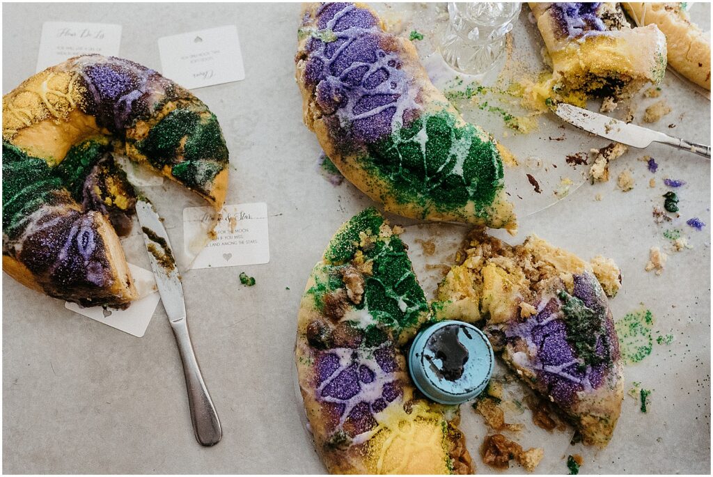 Slices of king cake sit on a table at a wedding reception.