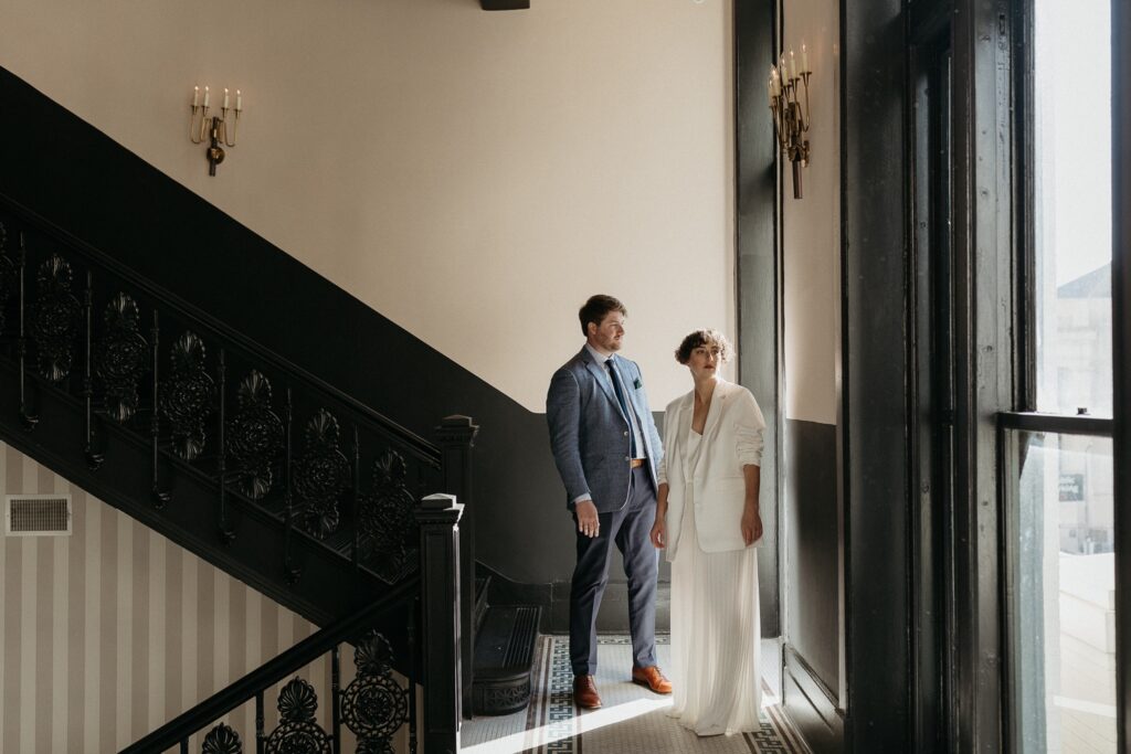 bride and groom in stairway at Maison de la Luz in New Orleans