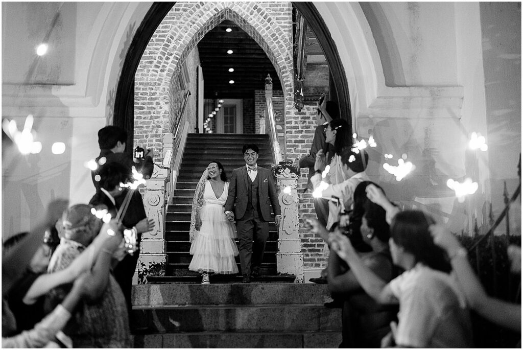 Wedding guests hold up sparklers for a reception exit at Felicity Church weedding.