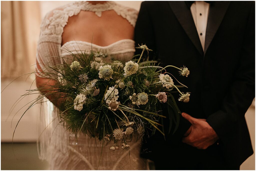 A New Orleans bride carries a unique bridal bouquet.