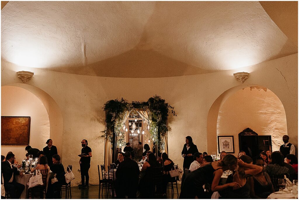 Wedding guests eat dinner inside a domed room in Latrobe's New Orleans.