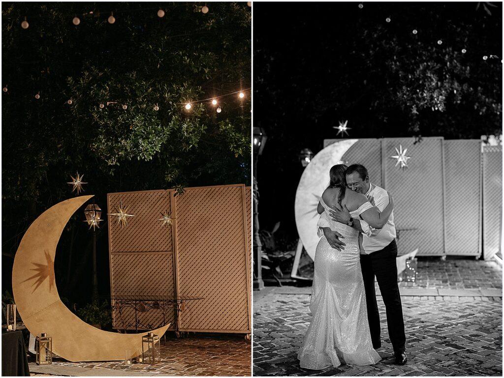 A bride hugs her father beside a crescent moon installation.
