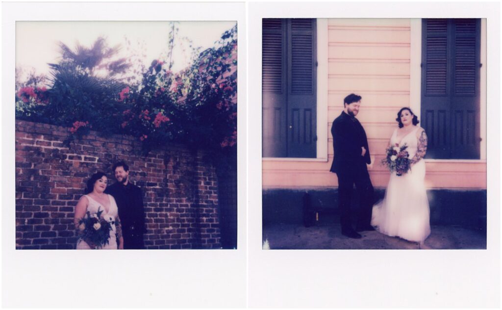 A bride and groom stand beneath roses growing over a brick wall in the French Quarter.