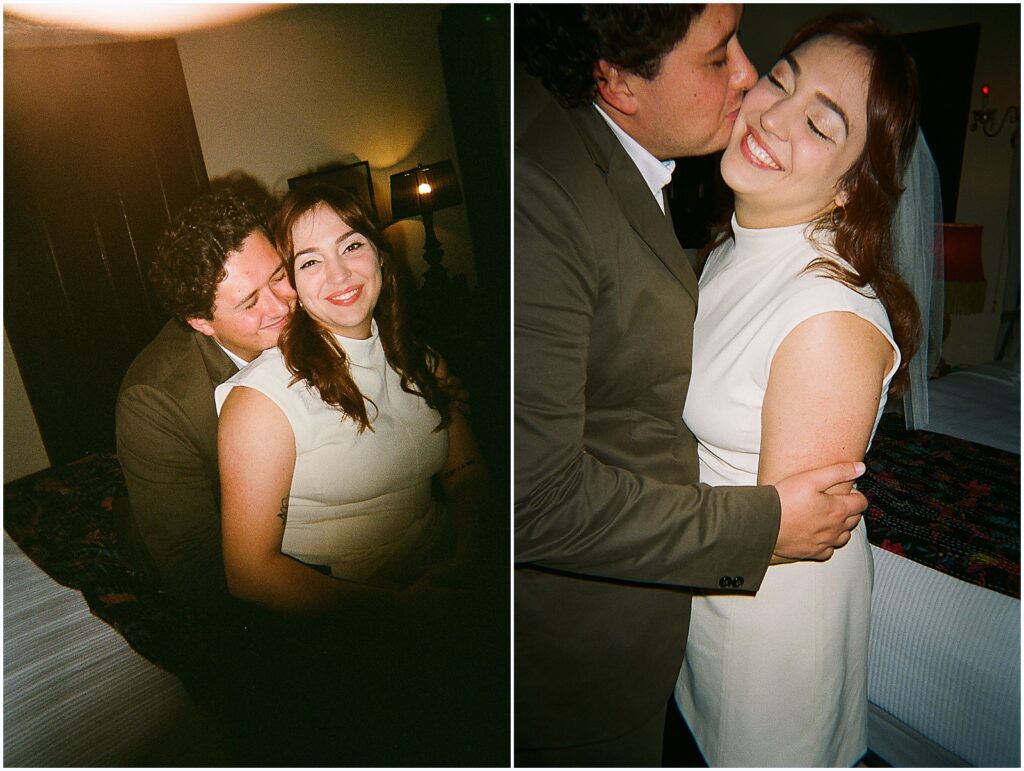 A man kisses a woman's cheek in a film engagement photo.