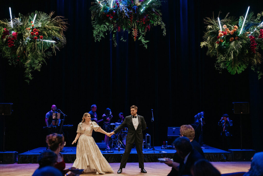 A newlywed couple doing a choreographed dance 