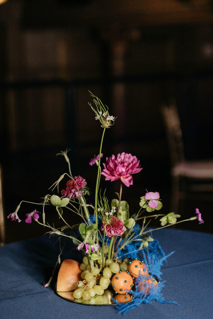 A colorful reception table centerpiece