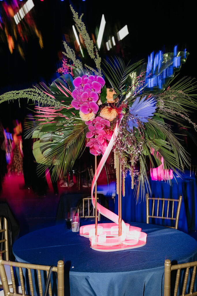 A colorful floral arrangement on a small table 