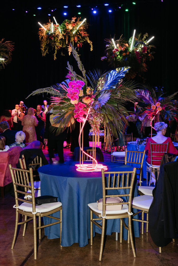 Brightly decorated wedding reception tables 
