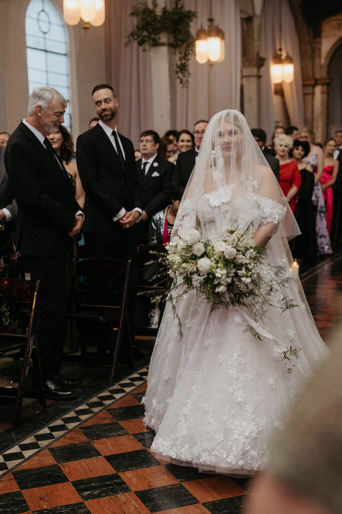 A bride walking down the aisle 