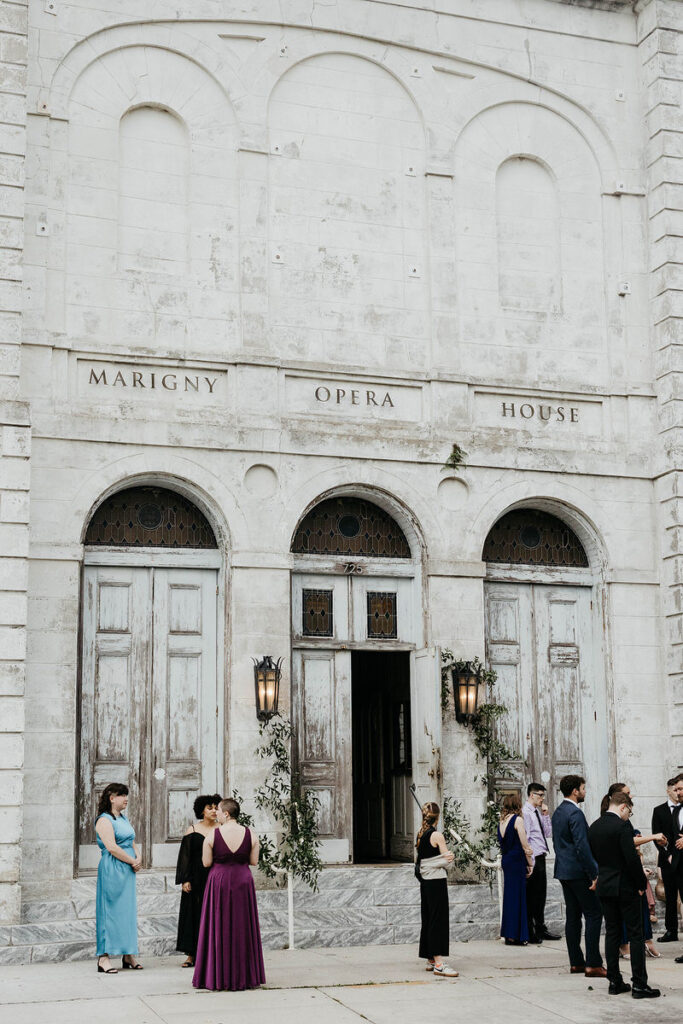 The outside of a stone opera theater 