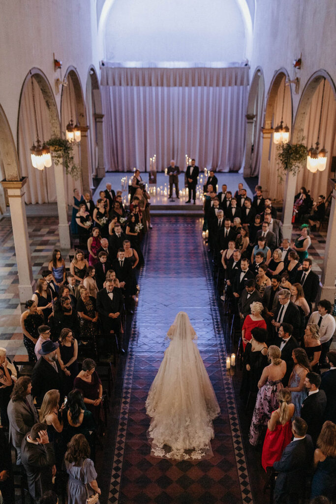 Overhead view of a bride walking down the aisle 
