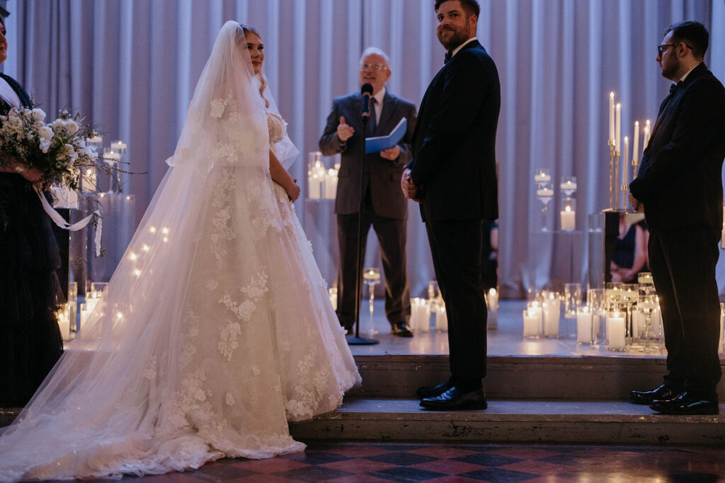 A couple standing at the altar at their wedding 
