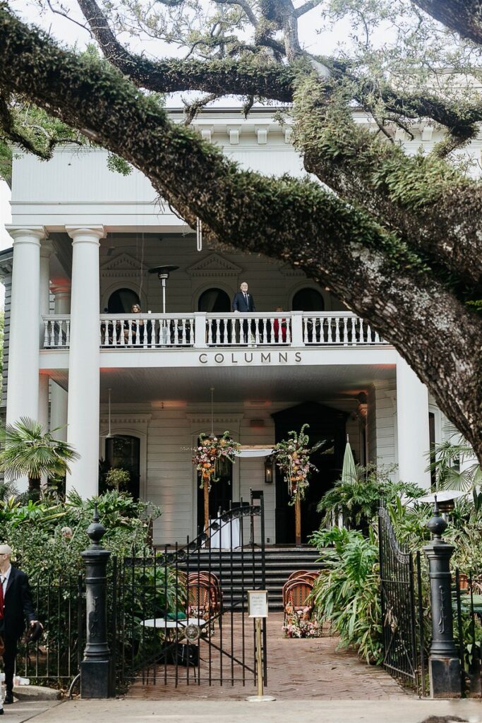 A wider view of the Columns venue, showing the building's grand facade and the wedding setup below.
