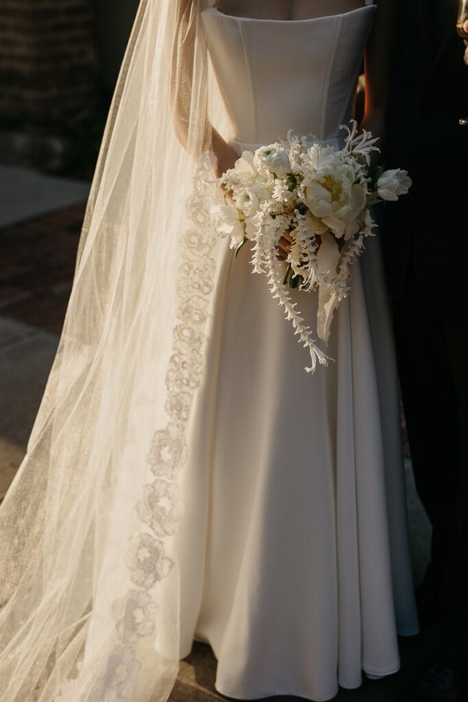 A bride holding a bouquet of flowers 