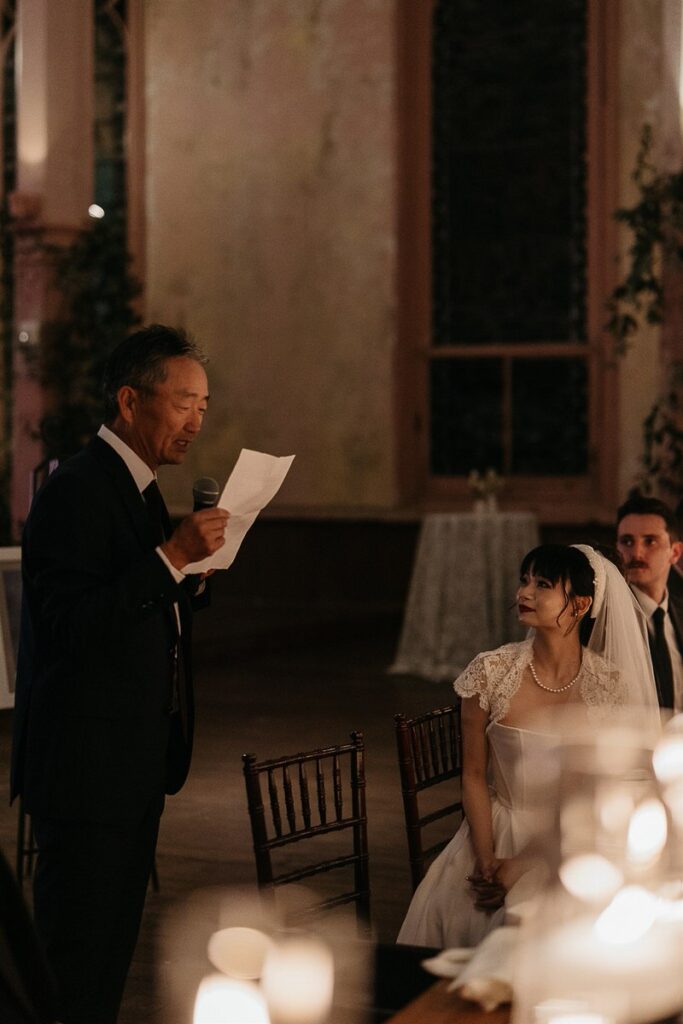 A man giving a speech at a wedding 