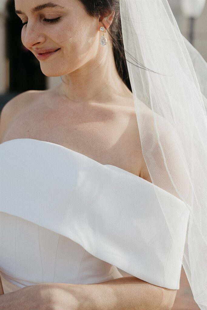 A close up of a person in a wedding dress 
