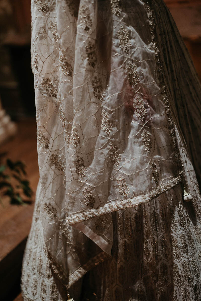 A close up of an intricate wedding veil
