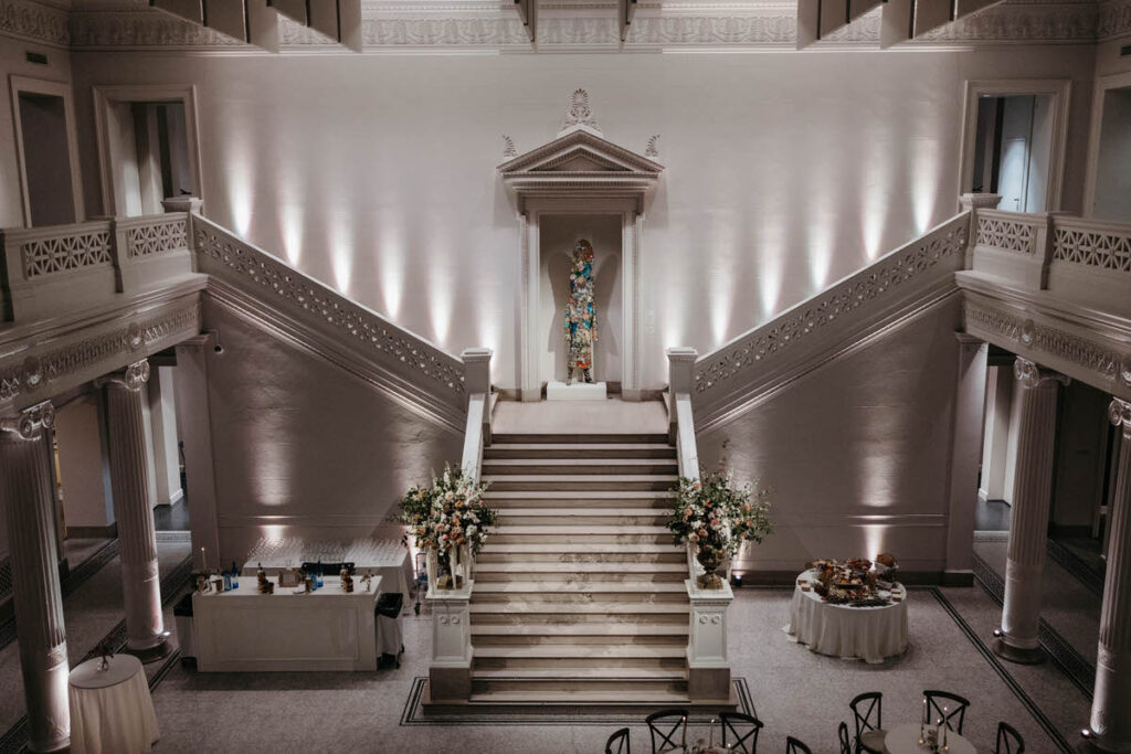 A grand staircase leading down into a reception area