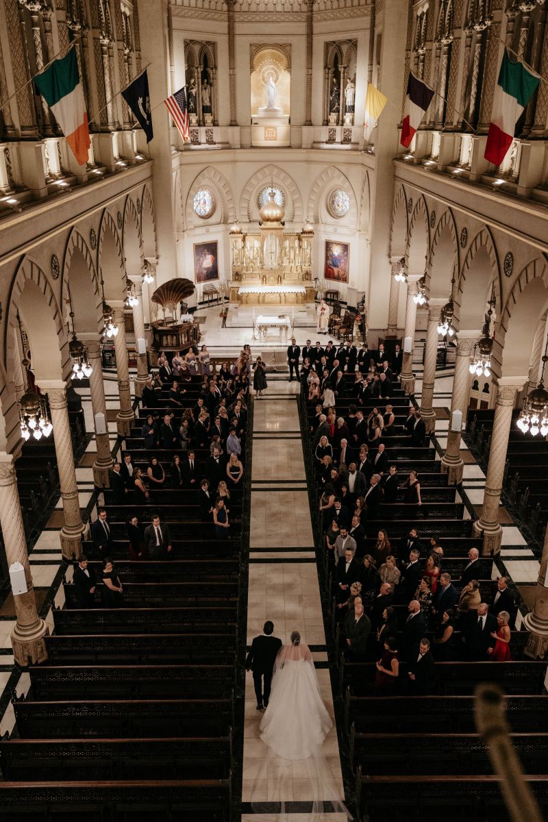 a couple having their wedding ceremony at the Immaculate Conception Jesuit Church in new orleans